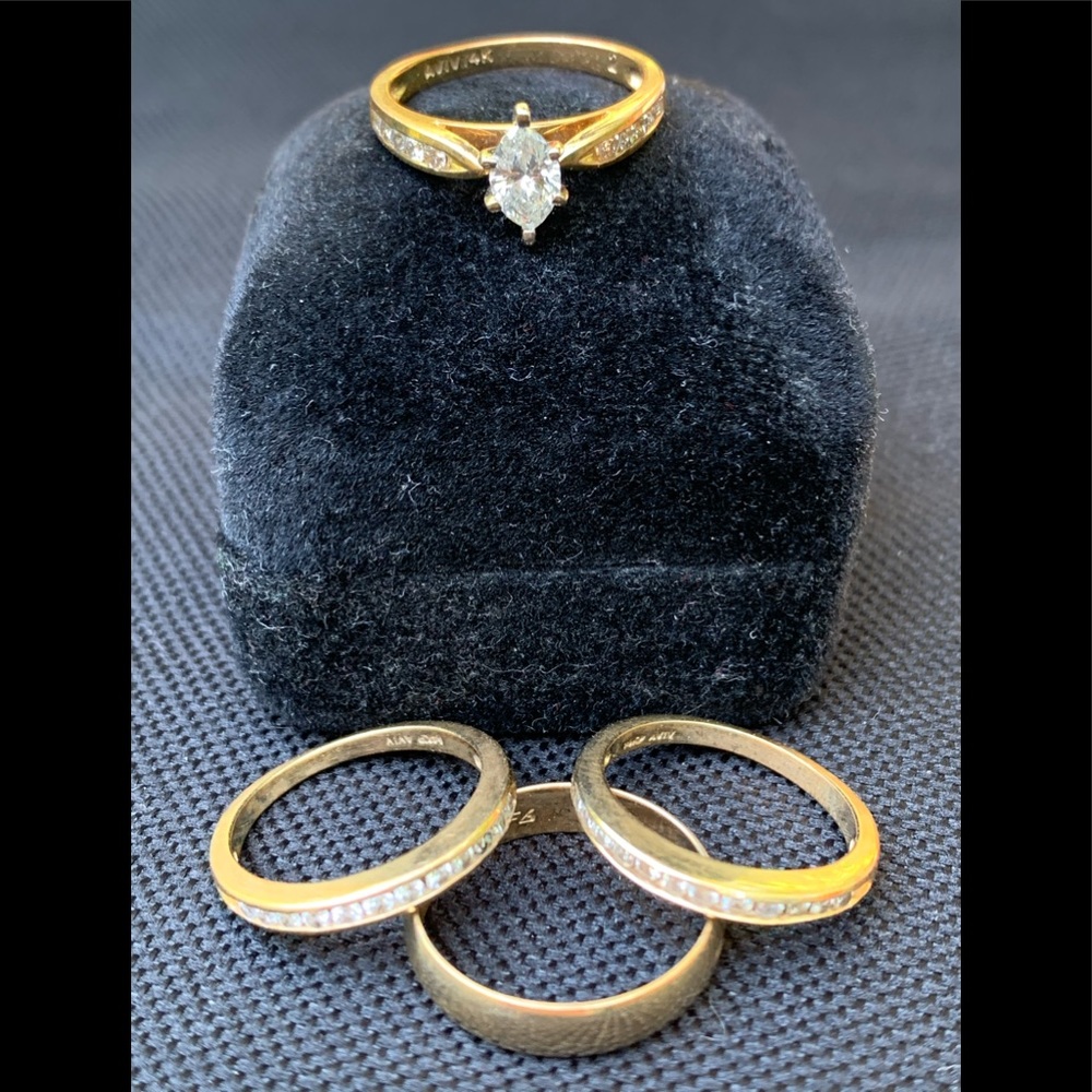 4 rings. 1 wedding, 2 anniversary , 1 gold band.